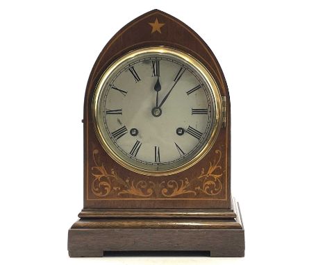 A mahogany and inlaid lancet shape mantel clock, circa 1900, with silvered dial, striking on two gongs, height 29cm.