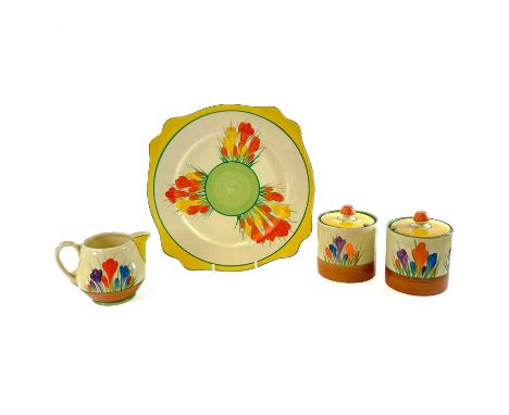 Clarice Cliff, crocus pattern, two preserve pots and covers, each of cylindrical form, height 9.5cm, together with a small mi