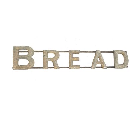 .A vintage bread advertising sign, wrought iron and gilt wood, early-mid 20th century, length 183cm.Lot 22This sign is in bar