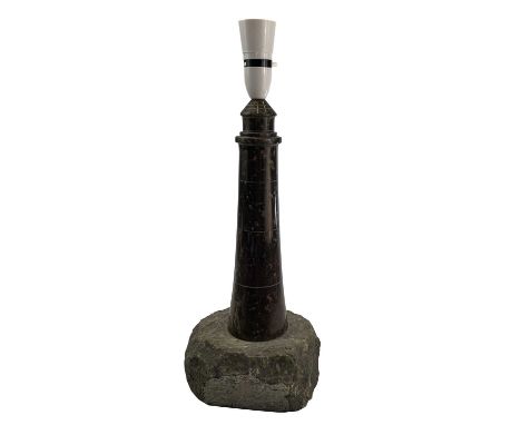 A Cornish serpentine turned and polished lighthouse table lamp on a rock base, height 39cm.