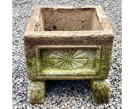 A reconstituted stone rectangular planter with indented moulded decoration raised upon a pair of lion mask supports, overall 
