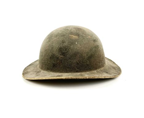 A 19th century leather mining helmet of bowl form with wide brim, height 14cm.