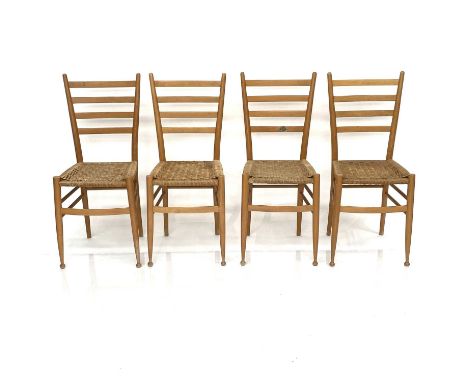 A Set of four beech ladderback dining chairs, in the style of Gio Ponti, with seagrass seats and turned underframes (4).Lot 1