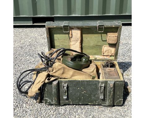 A WWII mine detector, contained in a canvas bag dated 1945 and in a metal-bound trunk, overall width 62cm.