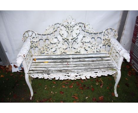 An ornate Coalbrookdale style cast iron wooden slatted Bench, 145 cm wide x 55cm deep x 90 cm. high