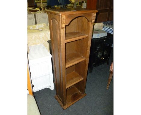 A small narrow, Oak four shelf Bookcase. 15 1/2" wide x 45 1/2" high.