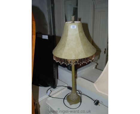 A modern Table Lamp with parchment style fringed shade