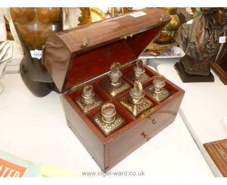 A Mahogany Decanter Box containing six gilt decorated bottles.