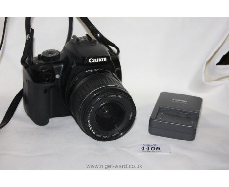 A Canon EOS 400D Digital SLR Camera with a Canon 18-55mm f/3.5-5.6 II Zoom Lens, charger, battery and 2GB memory card.