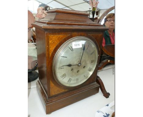 An Oak cased Gustav Becker Bracket Clock with three train movement, chiming on gong with polished metal face having Roman num