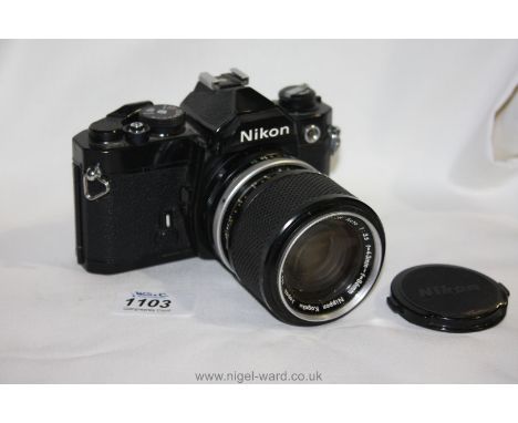 A Nikon FM Black 35mm SLR Camera with a Zoom Nikkor 43-86mm f/3.5 Lens.