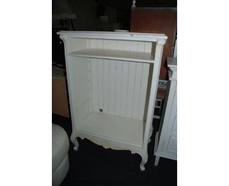 A white painted French style adjustable Shelf unit on cabriole legs, 50 1/2'' high, 33'' wide