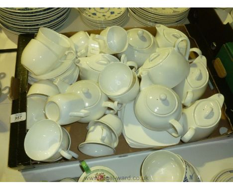 A quantity of white Teapots, cups and saucers