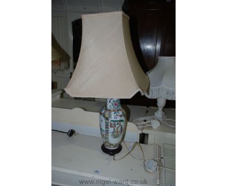 An oriental Table Lamp with beige shade