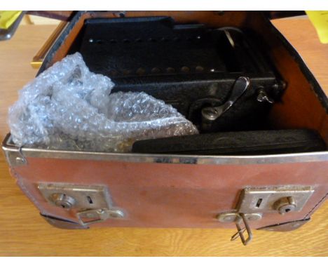 A vintage camera in case