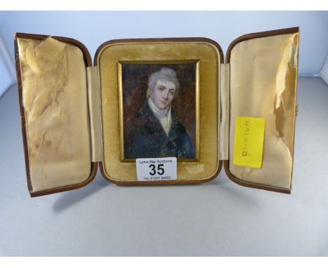 A miniature portrait of a gentleman in leather case