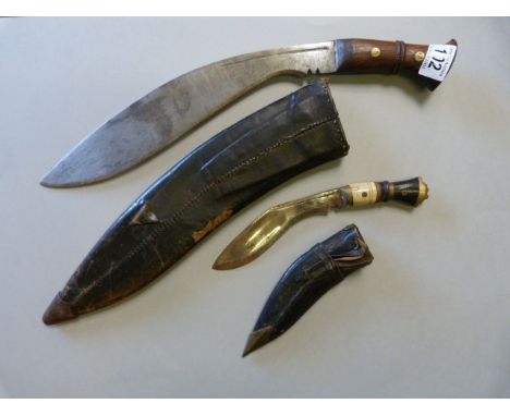 A 1929 war issue Kukri in leather scabbard and one other