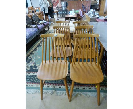 A set of six Ercol style blond dining chairs