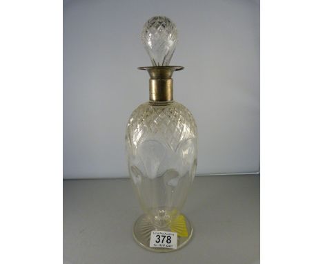 An Art Nouveau decanter with hallmarked silver collar