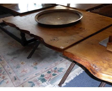 A modern cross-framed steel based centre table having shaped figured thick oak top, approx. 114cm x 130cmThe Auctioneer state