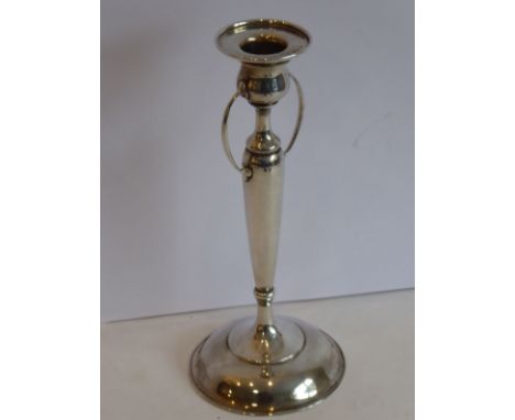 An Arts and Crafts style 925 standard silver candlestick (weighted and 21cms high)