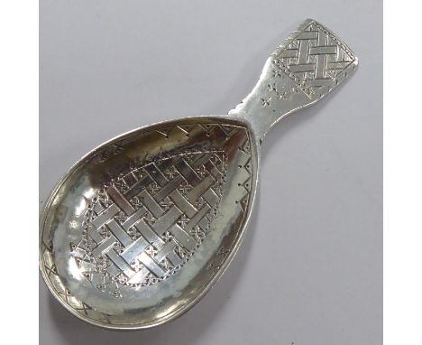 A hallmarked silver caddy spoon by Liberty &amp; Co., London; engraved with basket-weave and cross decoration, assayed Birmin