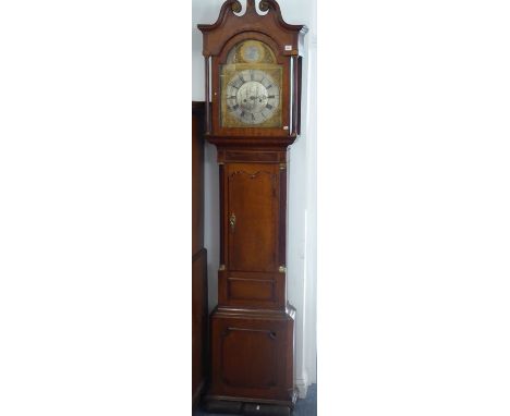 An early 19th century oak and mahogany cased eight-day longcase clock; the 13.15" broken-arch dial with silvered chapter ring