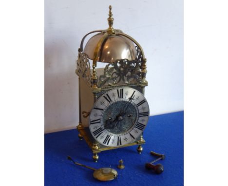 A good 19th century brass lantern clock in the 17th century style; silvered chapter ring with Roman numerals surrounding cent