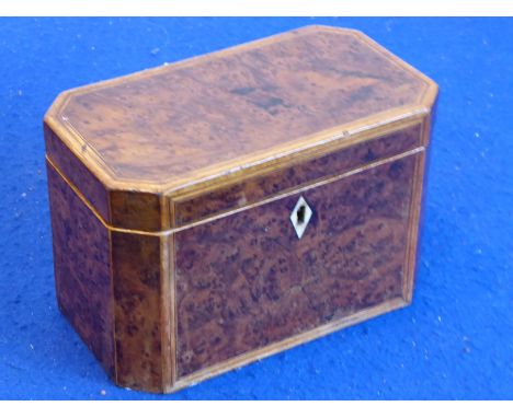 A George III period amboyna and boxwood-strung rectangular tea caddy; canted corners and with original interior lids and key,