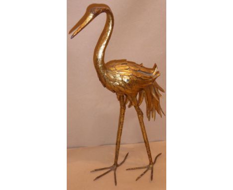 An early to mid-20th century decorative gilt-metal stork (47.5cm high) The stork is quite heavy and exhibits some oxidisation