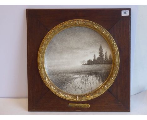 A late 19th century French ceramic wall-mounted dish signed Henri Beineix lower right; the dish with a raised gilded border o