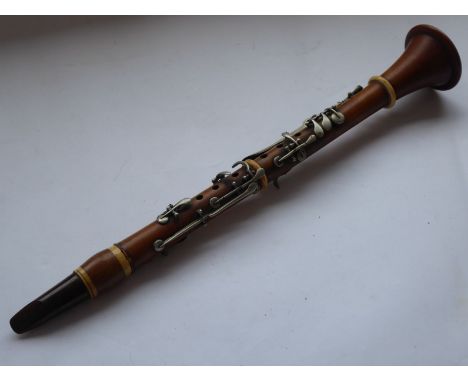 A 19th century oboe (PLEASE NOTE, ITEM IS IN FACT AN EARLY CLARINET)&nbsp; with crown mark to the centre piece (48 cm)