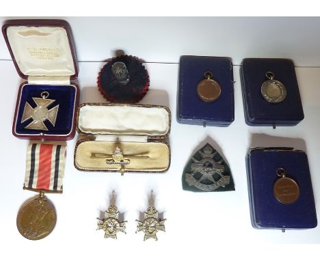 Four cased medals (3 school sports and 1 army rifle competition), a George V Special Constabulary&nbsp;Long Service Medal to 