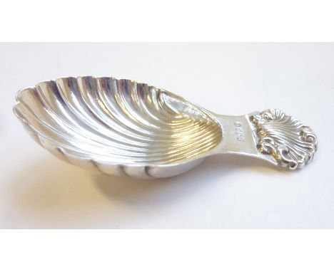 A modern hallmarked silver caddy spoon in the shape of a scallop shell&nbsp;