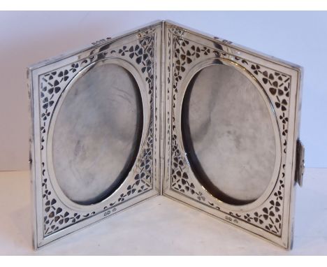 A heavy hallmarked silver double photograph frame; marked for the Goldsmiths & Silversmiths Company, Regent Street, assayed L