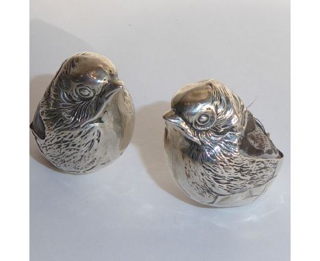 A rare pair of Edwardian hallmarked silver pincushions modelled as wrens; maker's mark of Sampson Mordan &amp; Co., one cushi