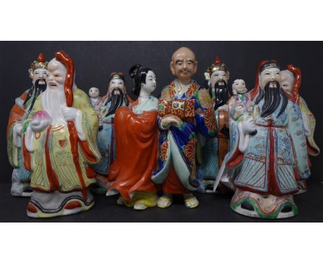 A collection of seven 20th century Chinese ceramic figures, with character marks to bases 