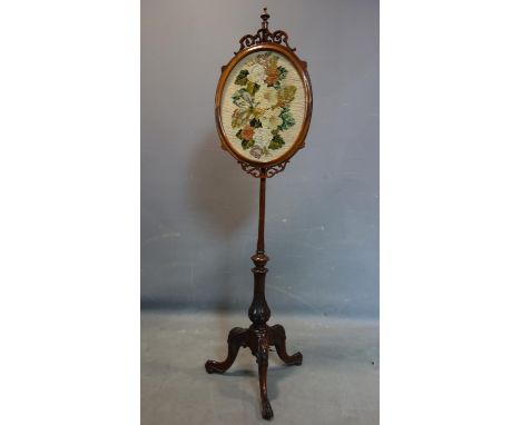 A late 19th century mahogany stand with tapestry screen depicting flowers, on three carved feet, H.142 W.36cm 
