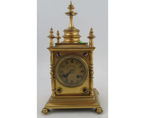 A Victorian gilt metal cased mantel clock, with striking movement, the gilt dial inscribed J W Benson London, the case set wi