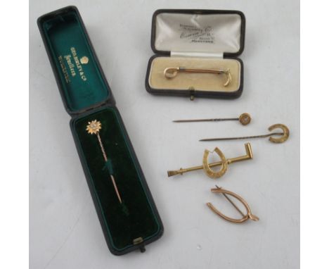 A 15ct gold hunting crop stock pin, together with two brooches and three Victorian stick pins