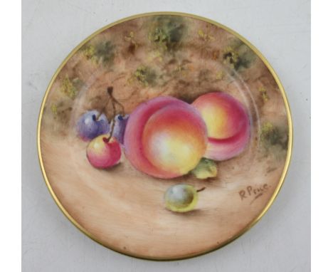 A miniature Royal Worcester plate, decorated with fruit by Price