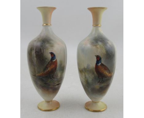 A pair of Royal Worcester vases, decorated with pheasants in a landscape&nbsp;by J Stinton, with blush ivory foot and neck, h