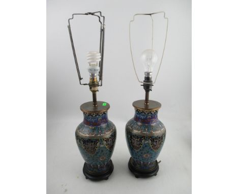 A pair of Oriental cloisonne baluster shaped table lamp bases, on wooden bases, height to top of vase 11insCondition Report: 