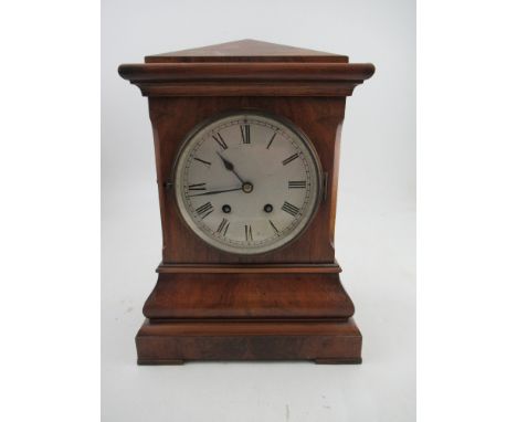 A 19th century mahogany striking mantel clock, with circular dial, height 14.5ins&nbsp;