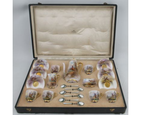 A boxed Royal Worcester coffee set, consisting of six coffee cans and saucers, a coffee pot, a milk jug and sugar bowl and a 