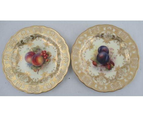 A Royal Worcester plate, the centre decorated with plums and logan berries by Richard Sebright, to a rich gilt boarder, dated