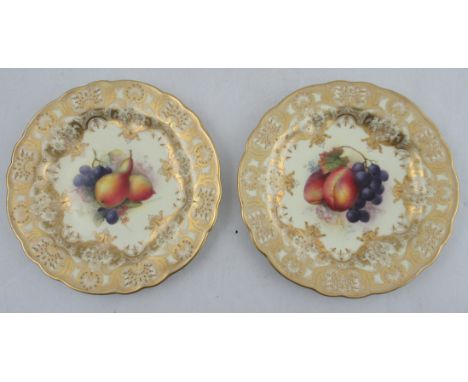 A Royal Worcester plate, the centre decorated with pears and grapes by Richard Sebright, to a rich gilt boarder, dated 1928 a