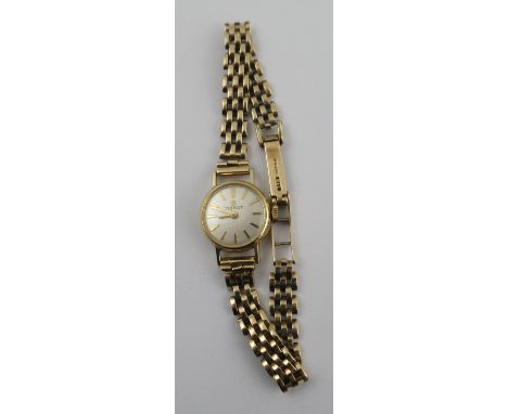 A 9ct&nbsp; gold Tissot Lady's watch, the dial with baton numerals and 9ct gold link bracelet, stamped '375', total weight 16