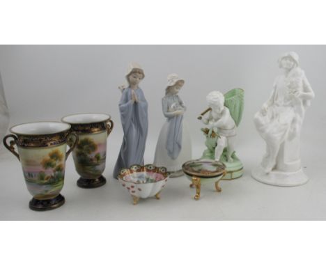 A collection of porcelain, to include a Moore Brothers figure, a Shelley white porcelain figure, two Nao figures, a pair of N