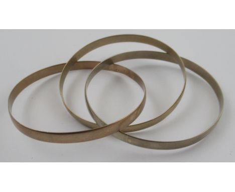 A 9ct triple bangle, in three colour gold, weight 27g